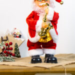 Giocattolo Natalizio Babbo Natale con tromba che canta e balla altezza 34cm alimentazione a batteria (3pile non incluse)