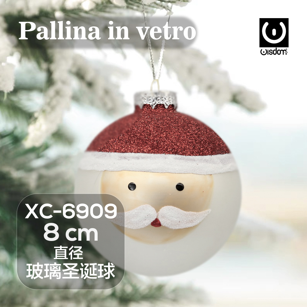 XC-6909 Pallina di Natale in vetro decorativa a forma babbo natale con dettagli cappello rosso glitterato dimensioni 8cm - immagine 1